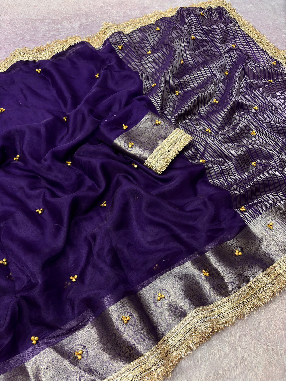 Royal purple organza ghungroo saree with Banarasi border and gold lace, draped view