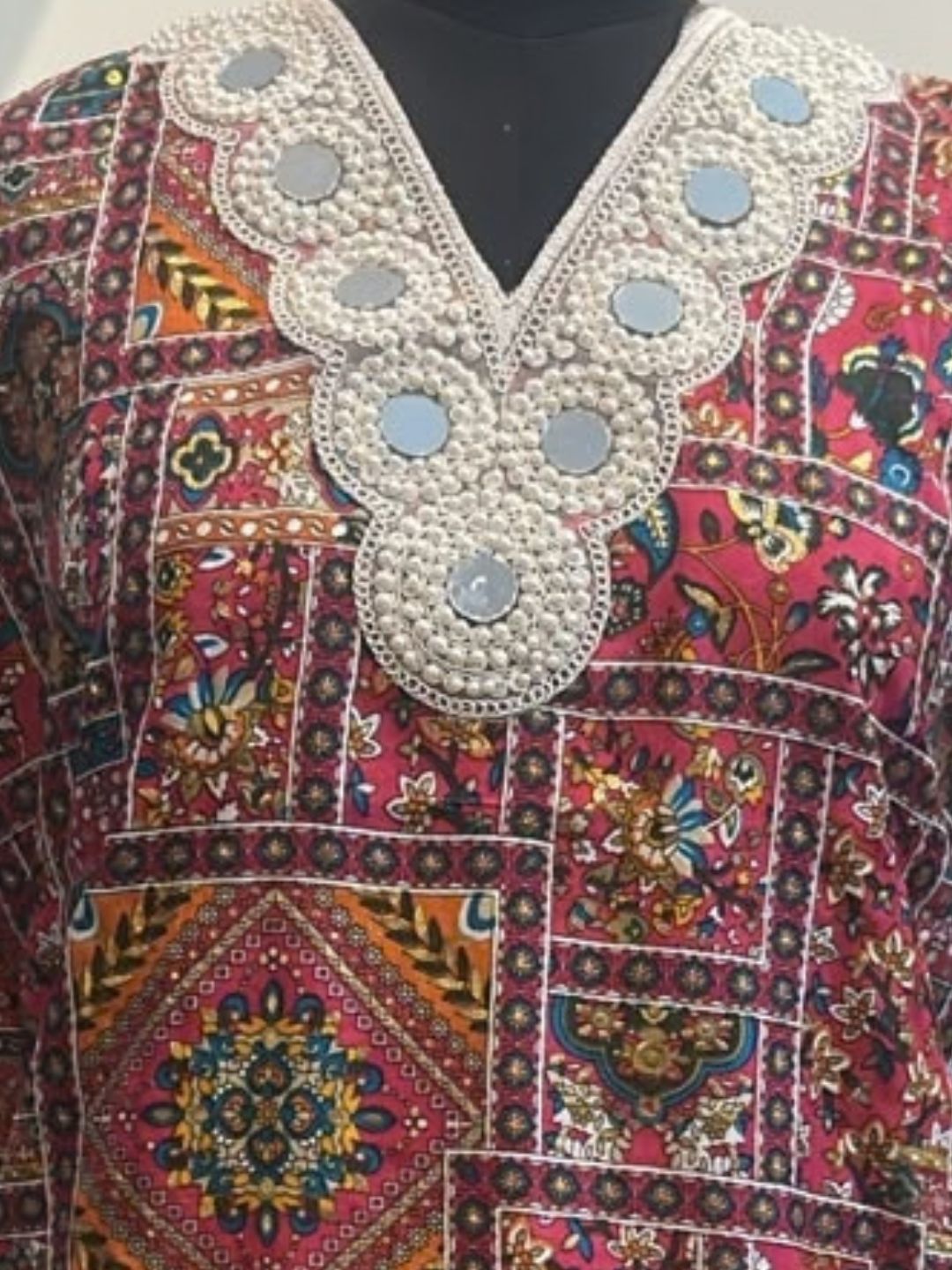 Rani pink printed kurta with white farshi salwar and pearl mirror lace neckline – work detail | Saviias Studioz
