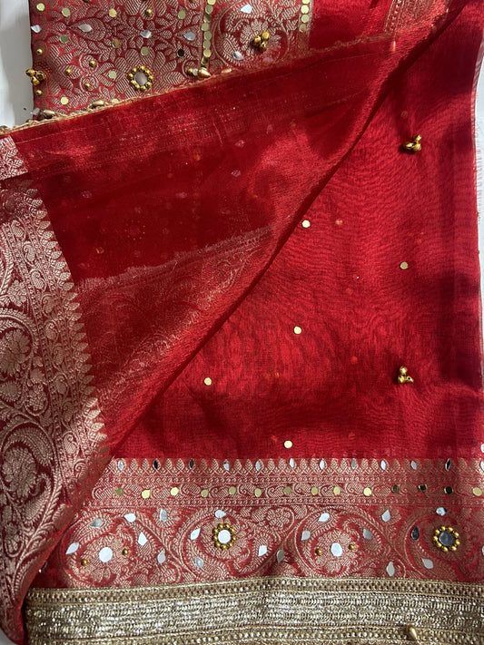 Ghungroo bell border on a red Banarasi saree, one of the most viral saree trends of 2026