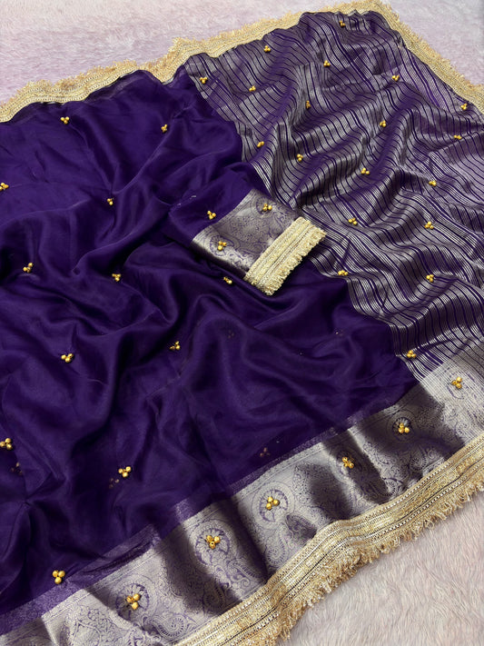 Royal purple organza ghungroo saree with Banarasi border and gold lace, draped view