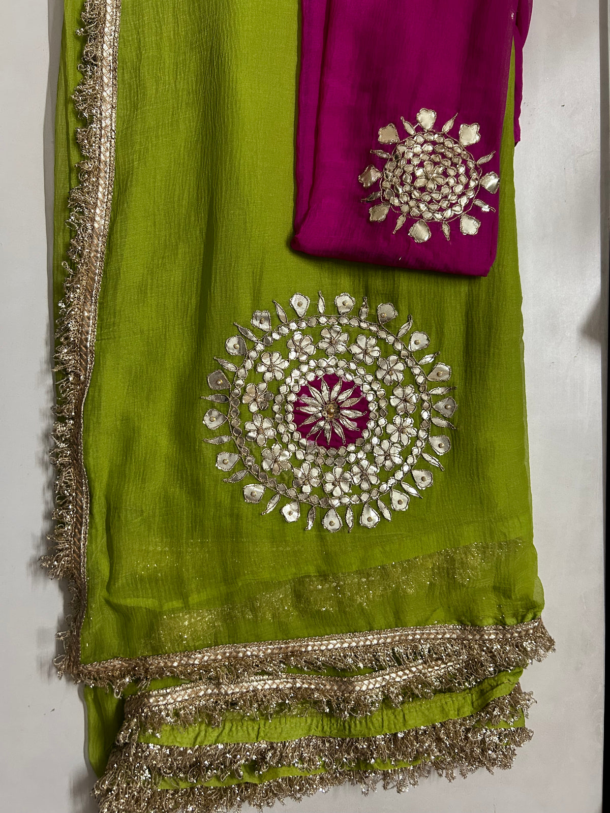 Parrot green gota and mirror work saree border close-up
