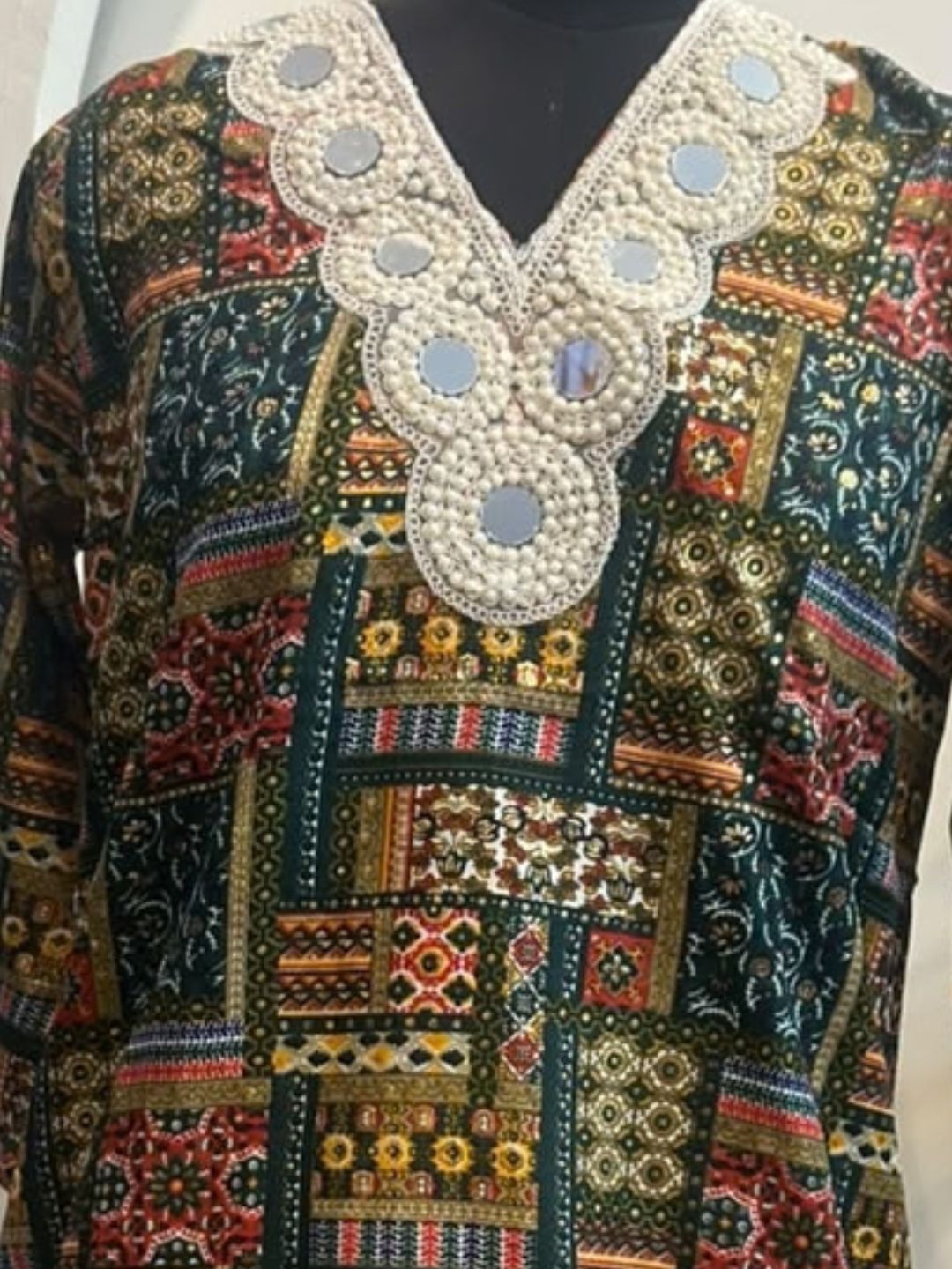 Bottle green printed kurta with white farshi salwar and pearl mirror lace neckline | Saviias Studioz