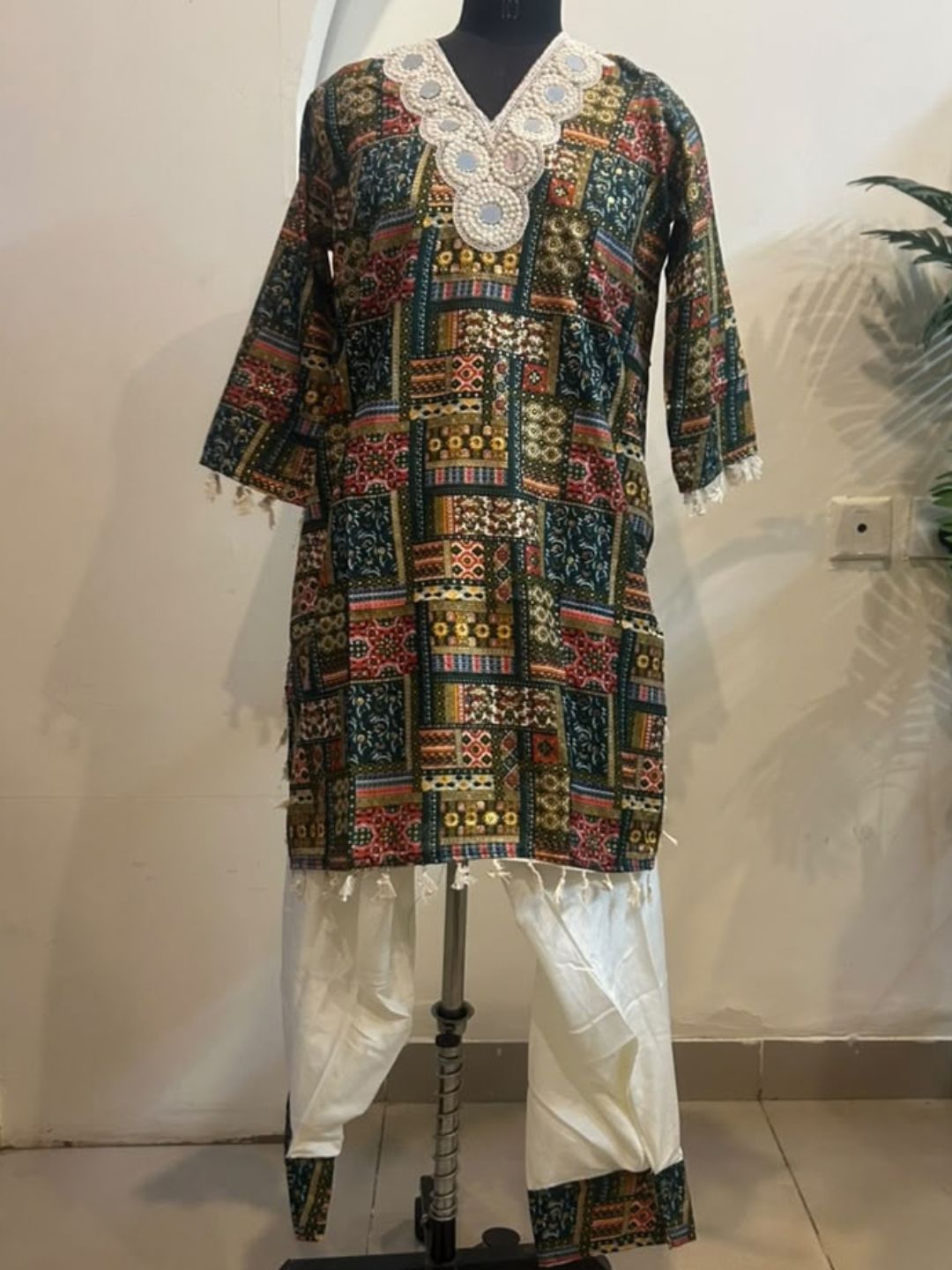 Bottle green printed kurta with white farshi salwar and pearl mirror lace neckline – work detail | Saviias Studioz