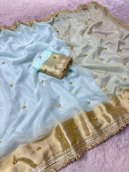 Ice blue organza ghungroo saree with golden Banarasi border, draped view