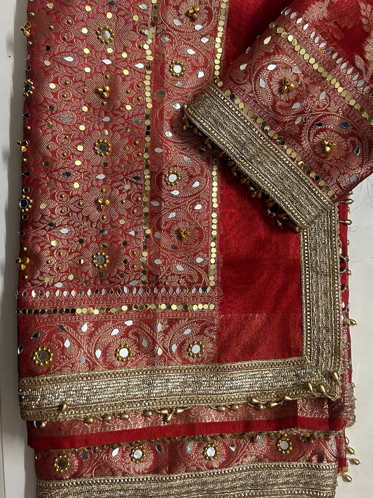 Red Banarasi ghungroo saree styled for Karwa Chauth and weddings