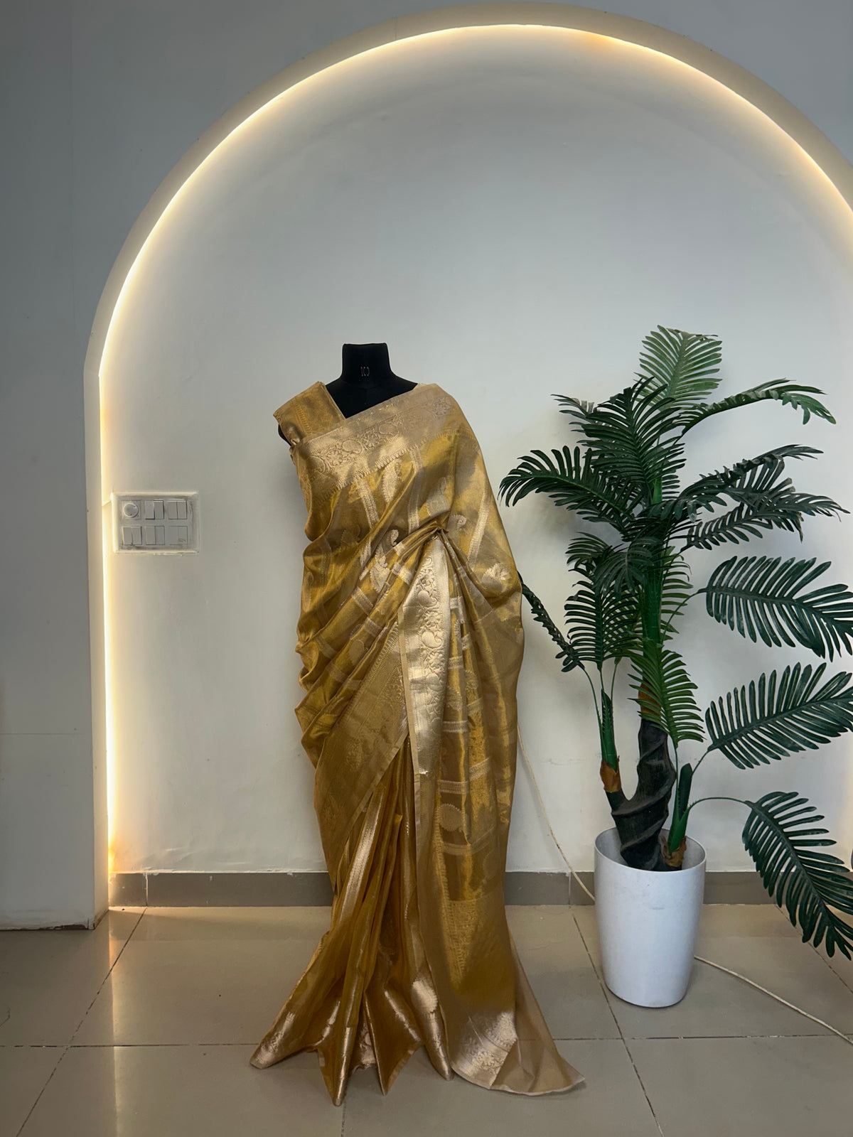 Golden Banarasi saree zari paisley weave close-up
