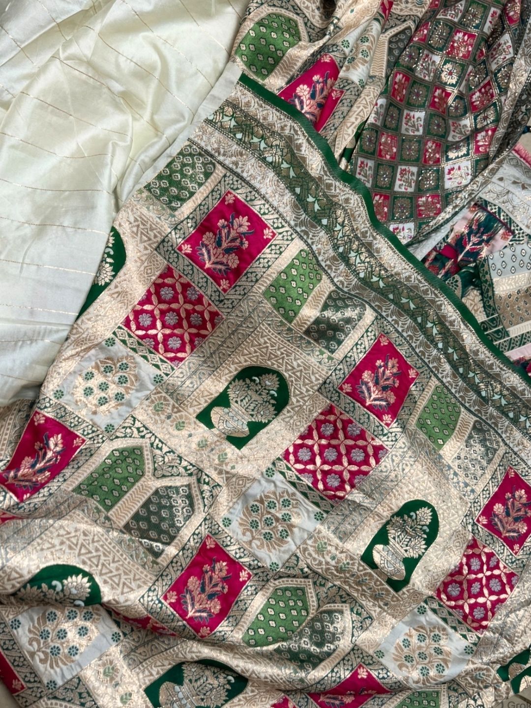 Sage green Banarasi silk saree meenakari pallu and zari border close-up