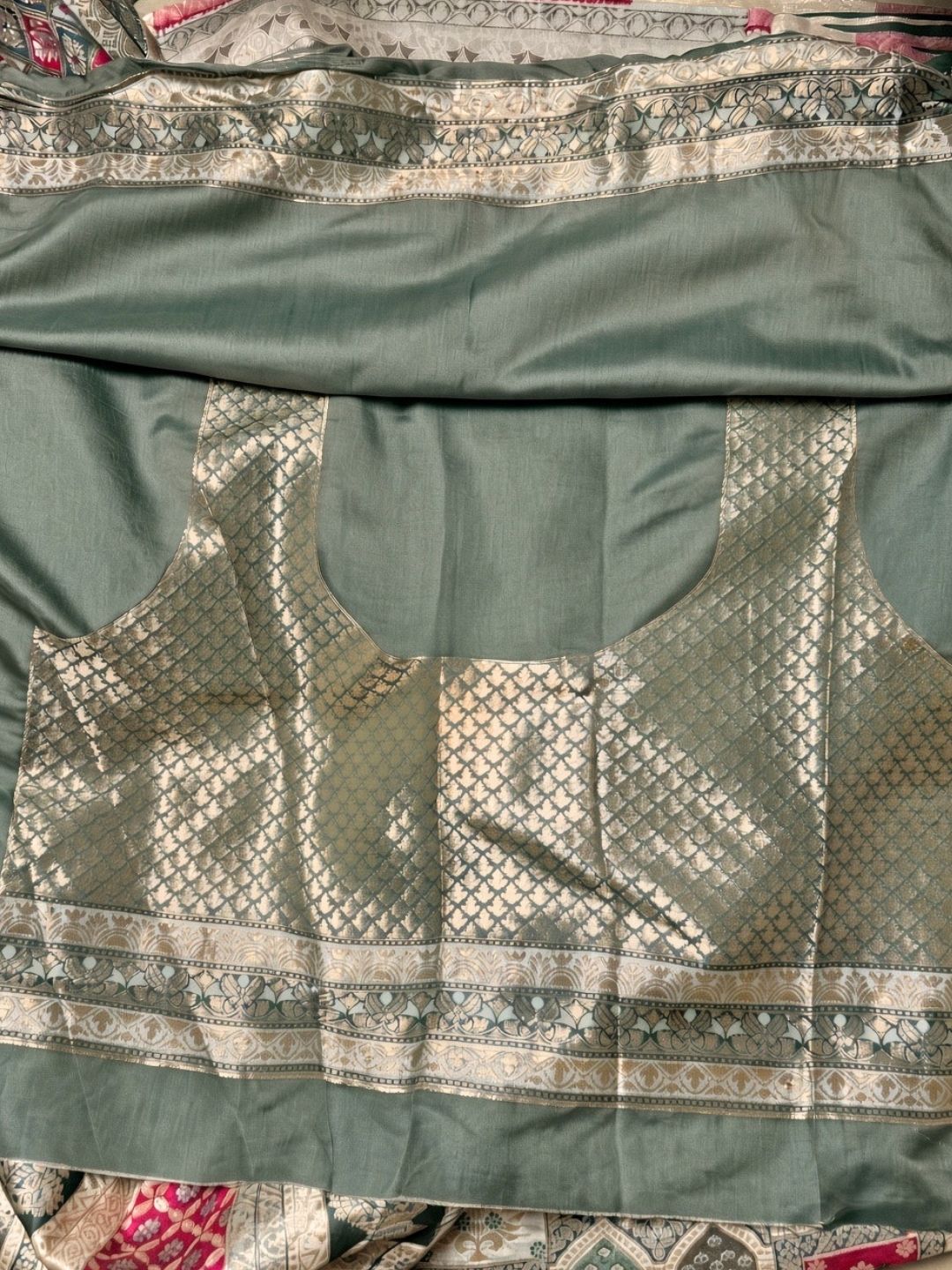 Sage green and rani pink meenakari Banarasi saree with tassels