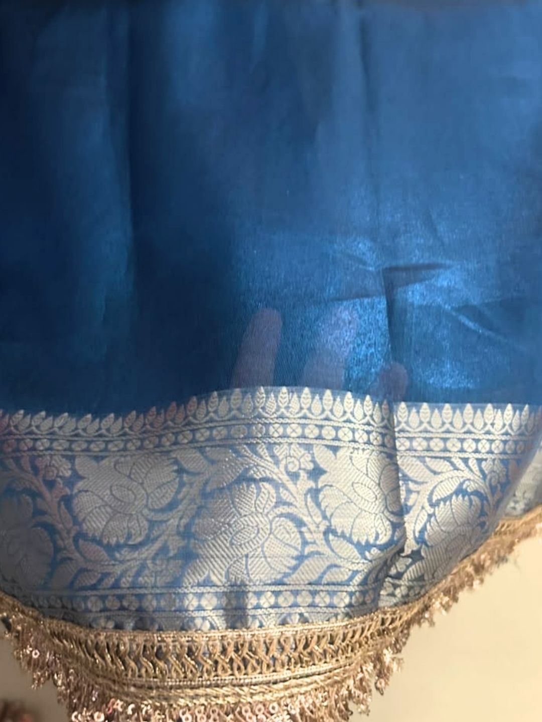 Peacock blue tissue organza saree gota lace and zari border close-up
