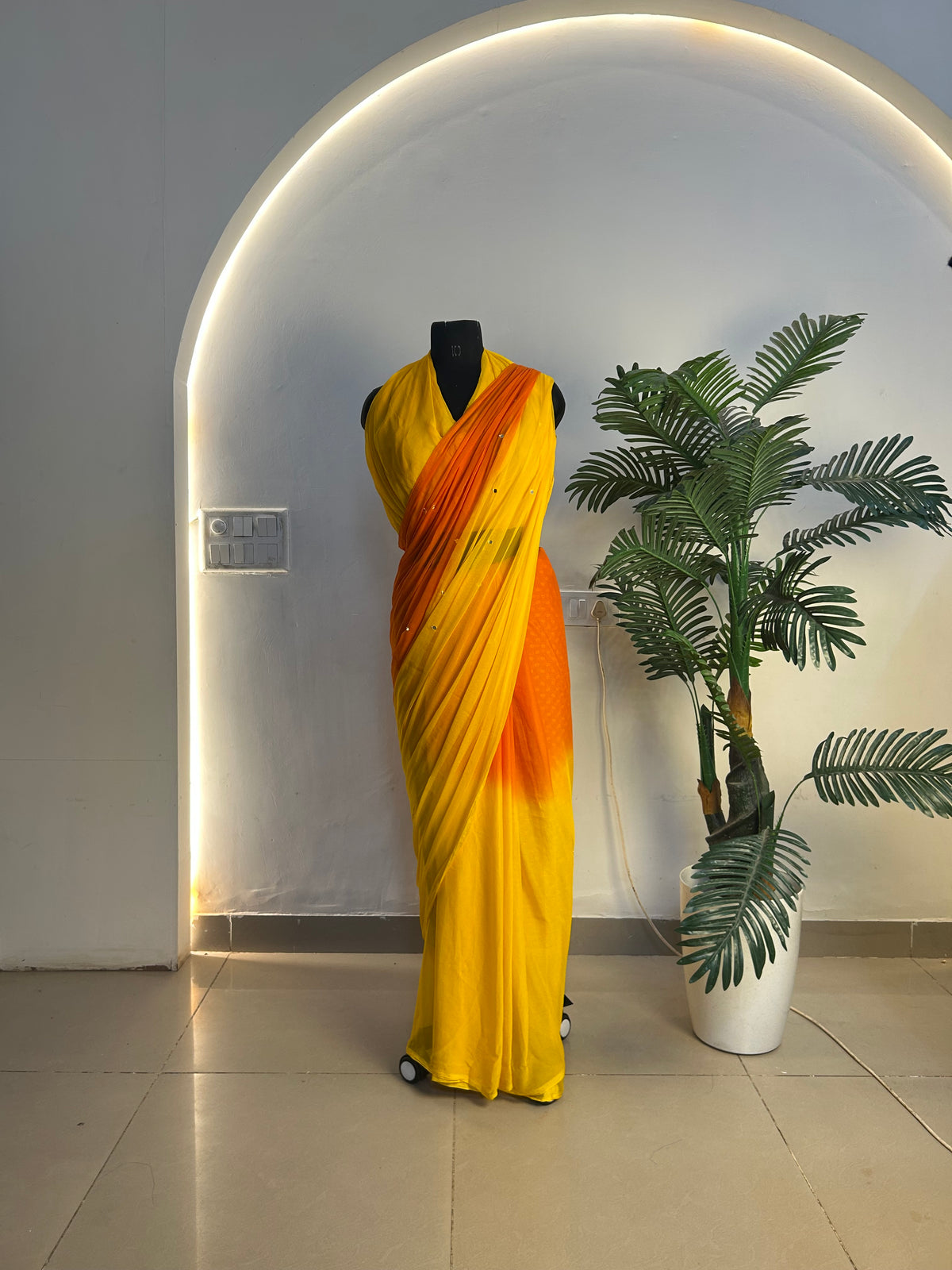 Orange-yellow ombre mirror work saree styled look