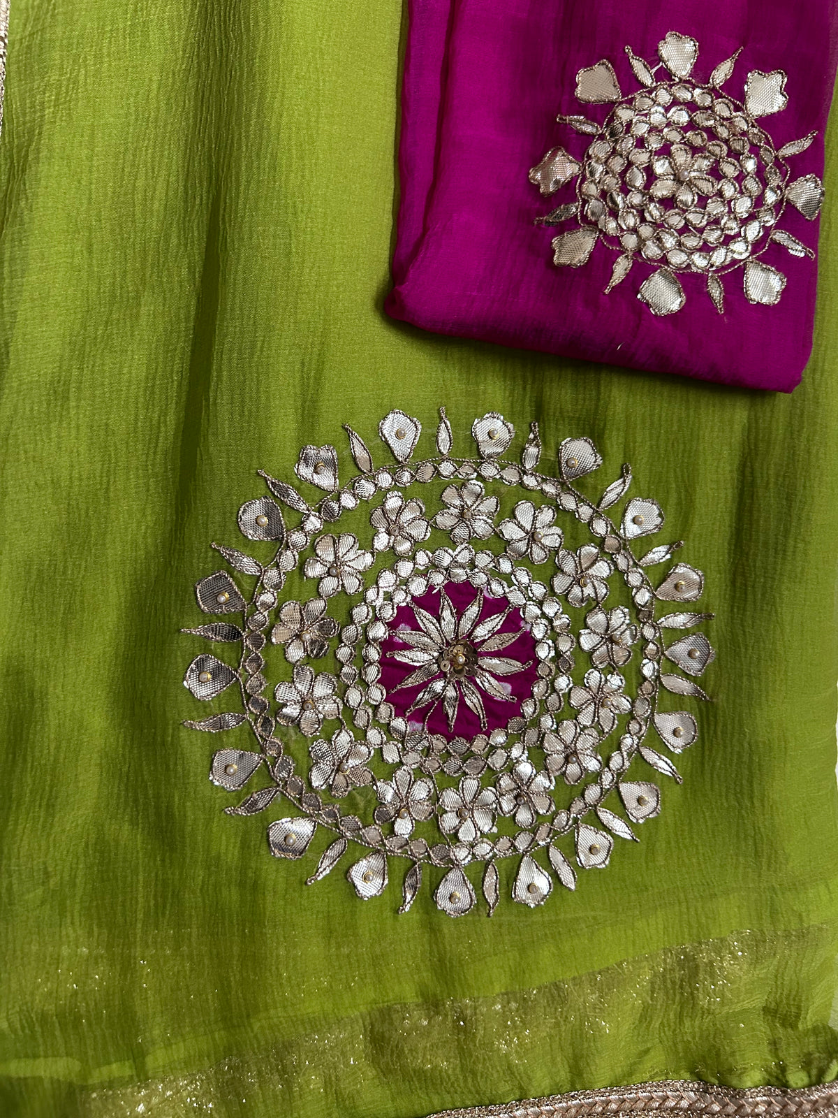 Parrot green gota work chiffon saree with pink blouse, draped view